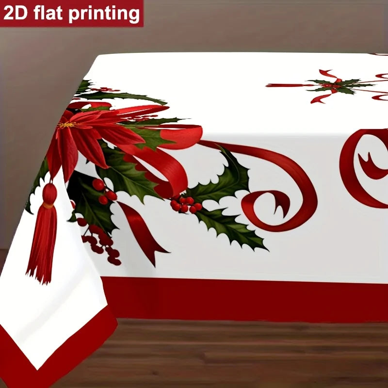 A white Christmas-themed tablecloth with a red border and a large red bow, green holly leaves, and red berries printed on it. The image shows a top-down view of the tablecloth draped over a table, with a brown background and a wooden floor.