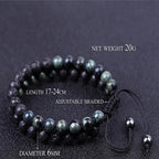 A beaded bracelet made of dark polished jasper stones with black braided cord, shown on a dark textured background with overlaid text noting net weight 20g, length 17-24cm, diameter 6mm, and Kambaba jaspers #605.