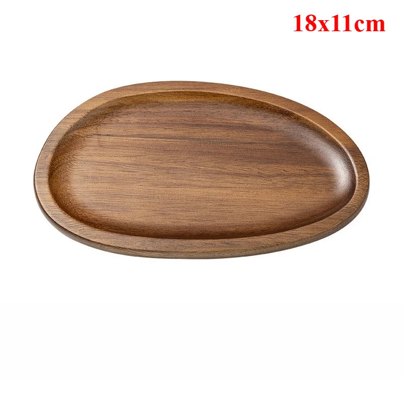 Wooden oval tray with dimensions 18x11cm on a white background
