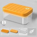 Orange storage container with clear lid on a gray background