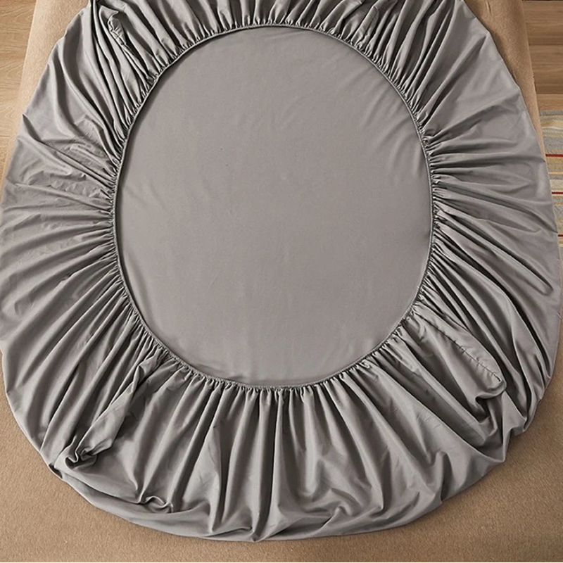 Gray round seat cover on a chair with 'vave' branding.