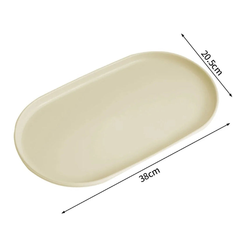 An oval beige tray or dish shown on a white background with dimension arrows and labels indicating 38 cm length and 20.5 cm width.
