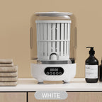 White dish dryer on a beige background with towels and bottles.