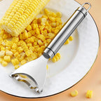 Corn shucker with corn on a white plate