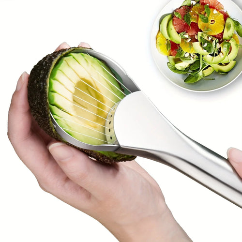 Avocado slicer cutting an avocado with a salad in the background