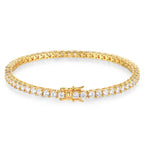 Gold bracelet with clear gemstones on a white background