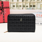 Black embossed wallet with a blurred cityscape background