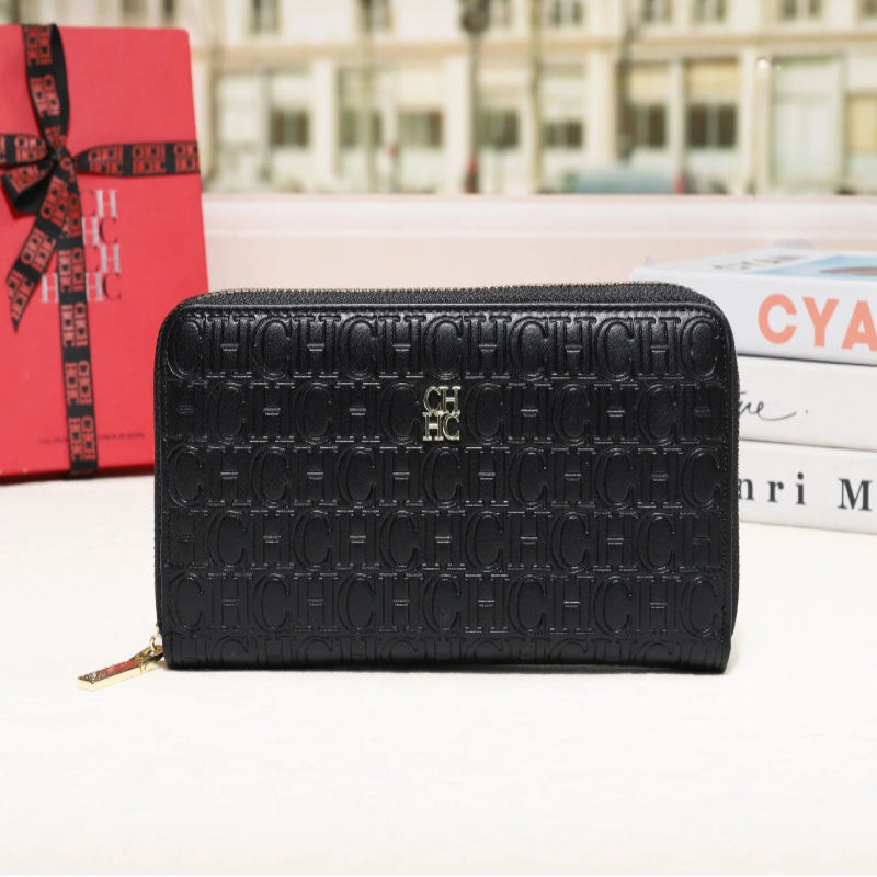 Black embossed wallet with a blurred cityscape background