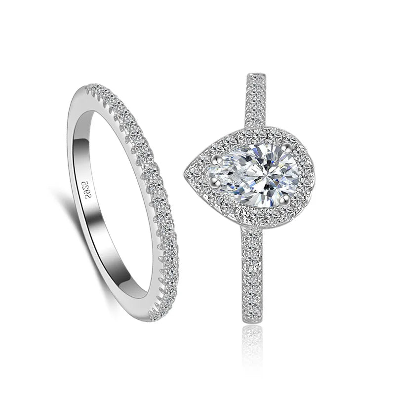Silver ring with diamond and another silver ring on a white background