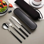 Black travel cutlery set with case on a table with fruits and a cup of tea.