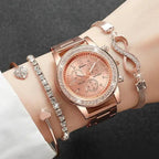 Rose gold watch and bracelet set on a wrist against a dark background