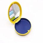 Compact mirror with colorful lenses on a white background