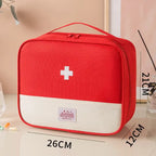 Red first aid kit with a white cross on a beige surface