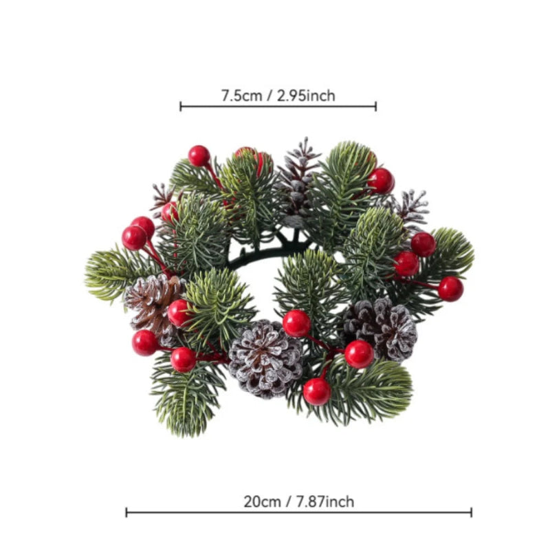 An artificial Christmas wreath with green pine needles, red berries, and faux pinecones, shown with dimension lines indicating a width of 20cm (7.87 inches) and a top diameter of 7.