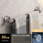 Towel holder with towel on a marble wall background, showing dimensions and features.