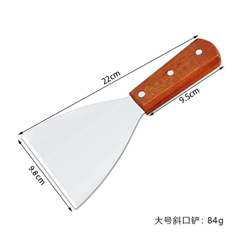 Measuring chart of a spatula with wooden handle and metal blade on a white background