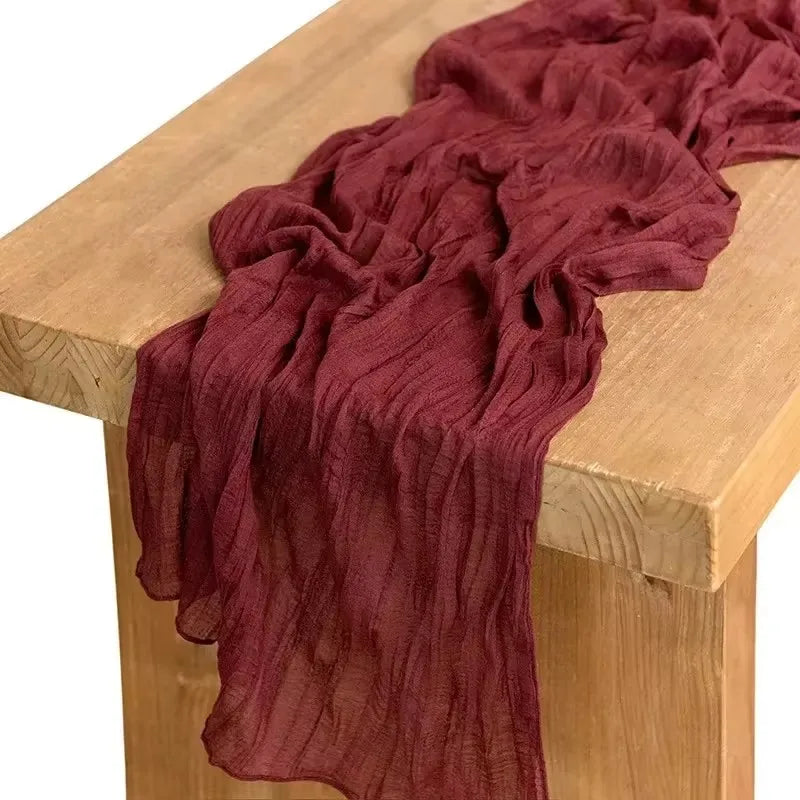 Red fabric draped over a wooden surface