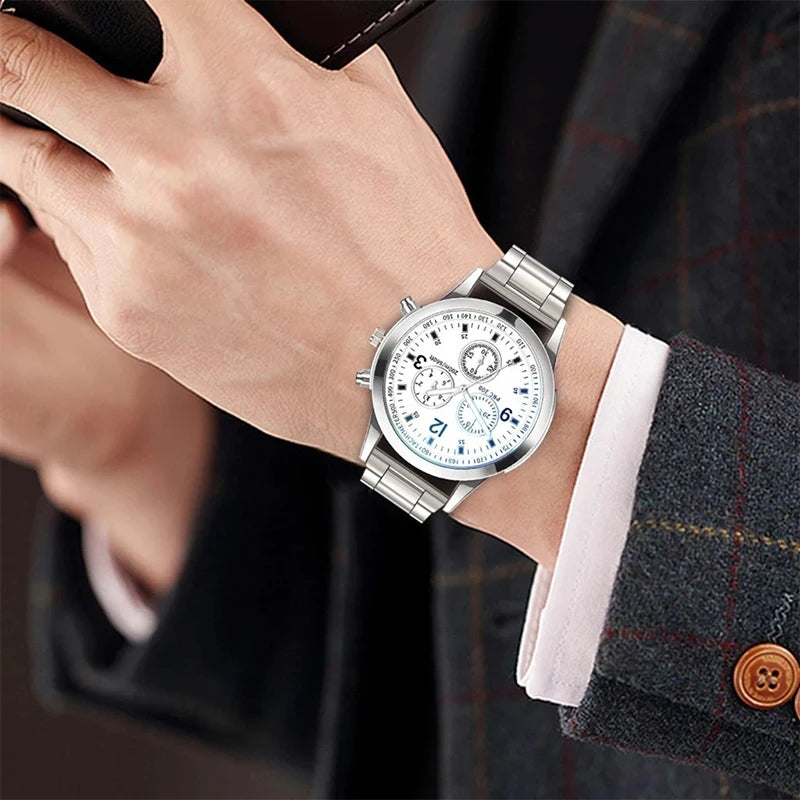 Men's silver-tone quartz wristwatch with stainless steel band and white multi-dial face, styled with a formal suit – EMESA HOME.