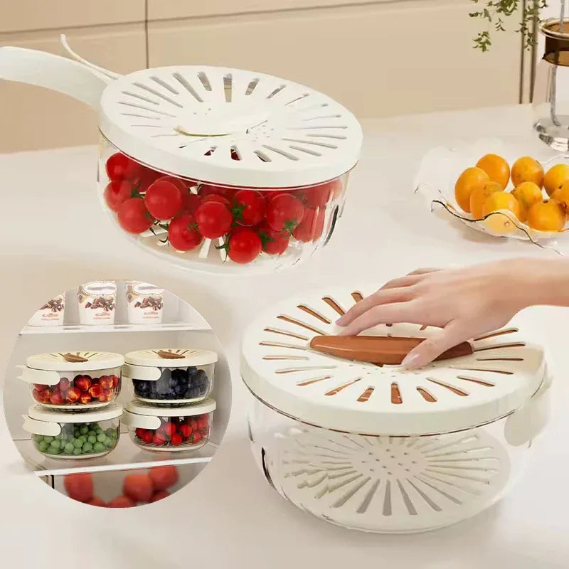 Fruit and vegetable storage container with a hand interacting with it on a kitchen counter.