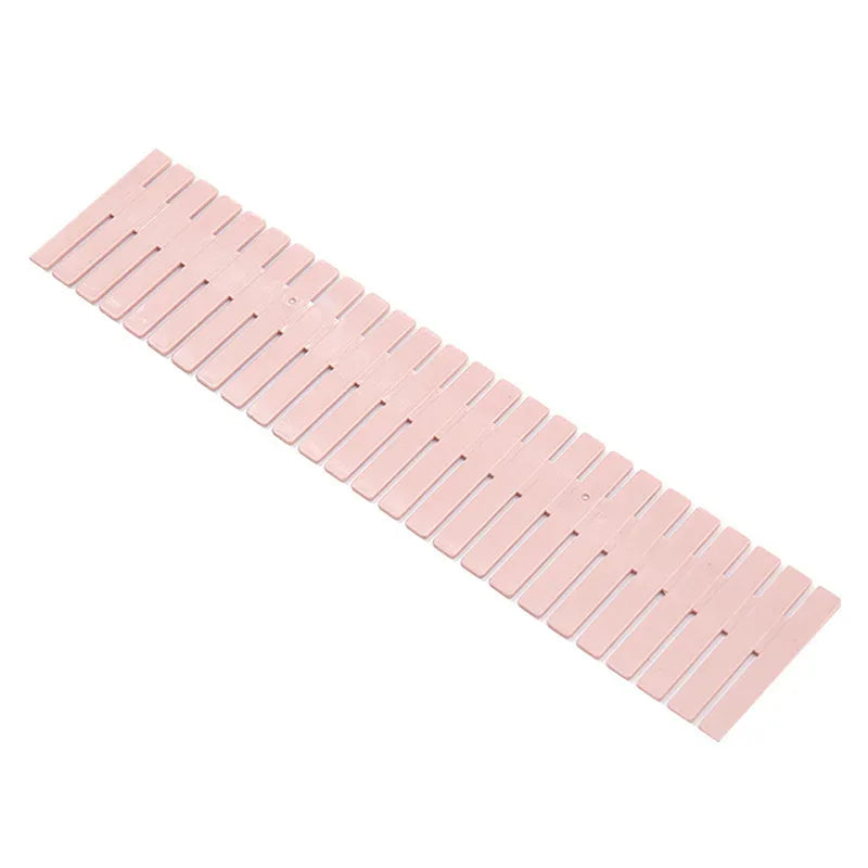 Pink wooden slat shelf on a white background
