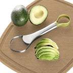 Avocado with a half-cut and sliced on a wooden cutting board with an avocado peeler.