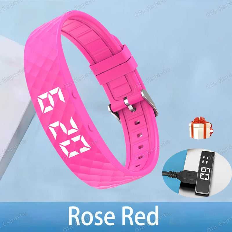 Rose red digital watch strap with charging cable on a light blue background