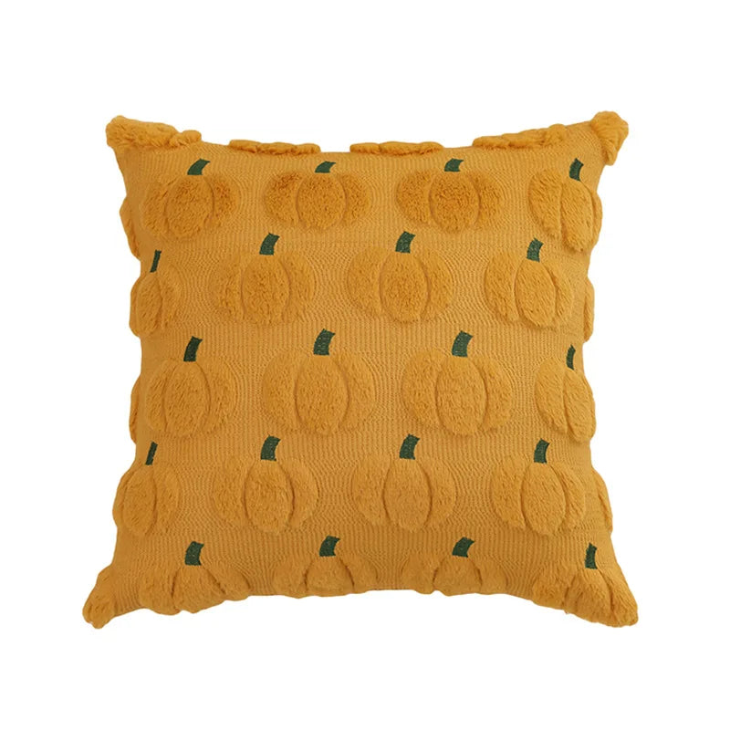 Yellow pillow with pumpkin pattern on a white background