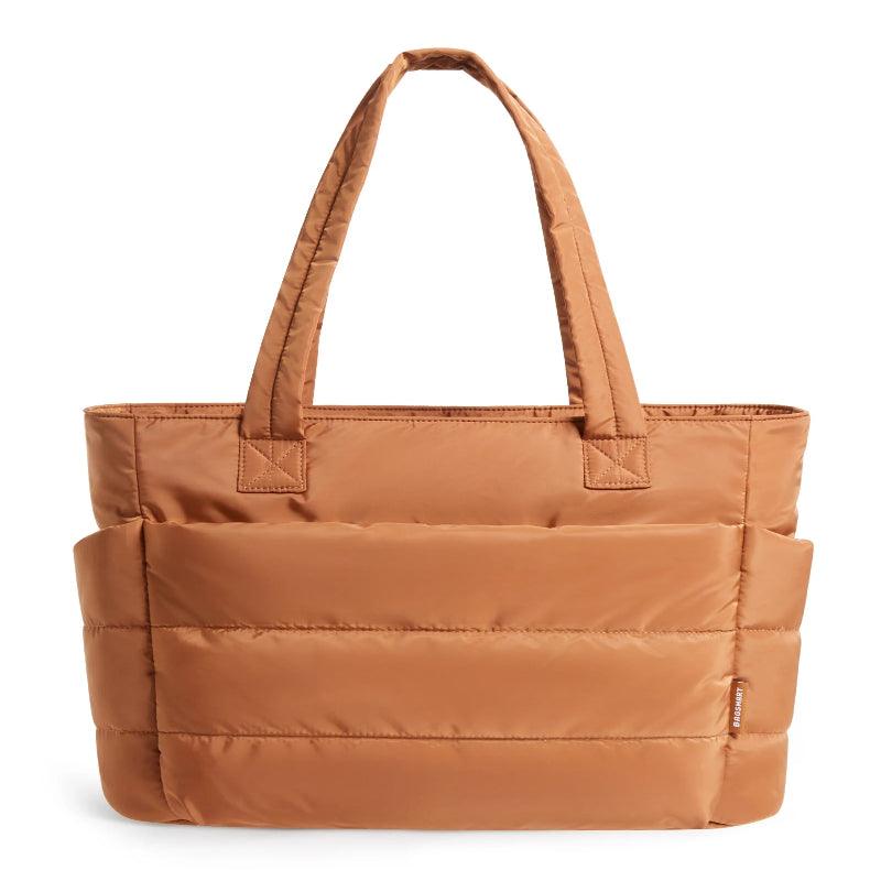 Brown tote bag with multiple pockets on a white background