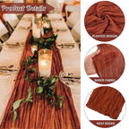 Red pleated table runner with candles and greenery on a table, with close-up details of fabric texture.