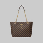 Designer handbag with gold chain and clasp on a wooden surface