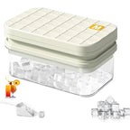 Ice cube mold with clear container and press lid, showing ice cubes inside.