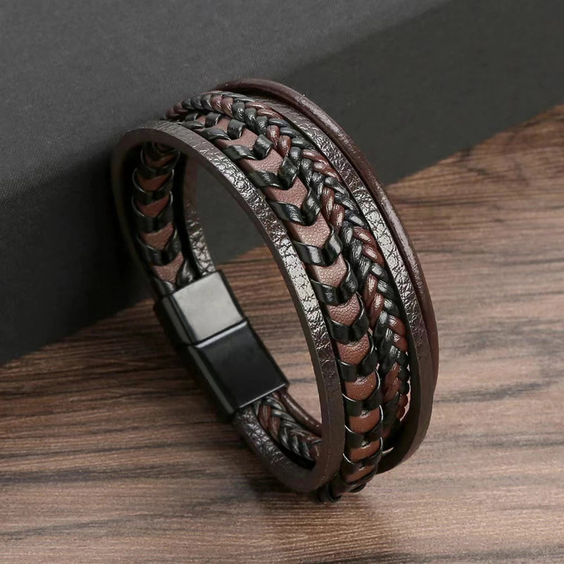 Brown braided leather bracelet on a wooden surface
