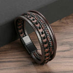 Brown braided leather bracelet on a wooden surface
