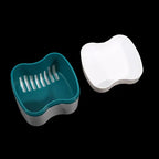 Teal and white plastic tools on a black background