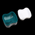 Teal and white plastic tools on a black background