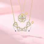 Gold necklace with heart-shaped pendants on a pink background