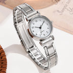 Silver wristwatch with a white dial on a light background