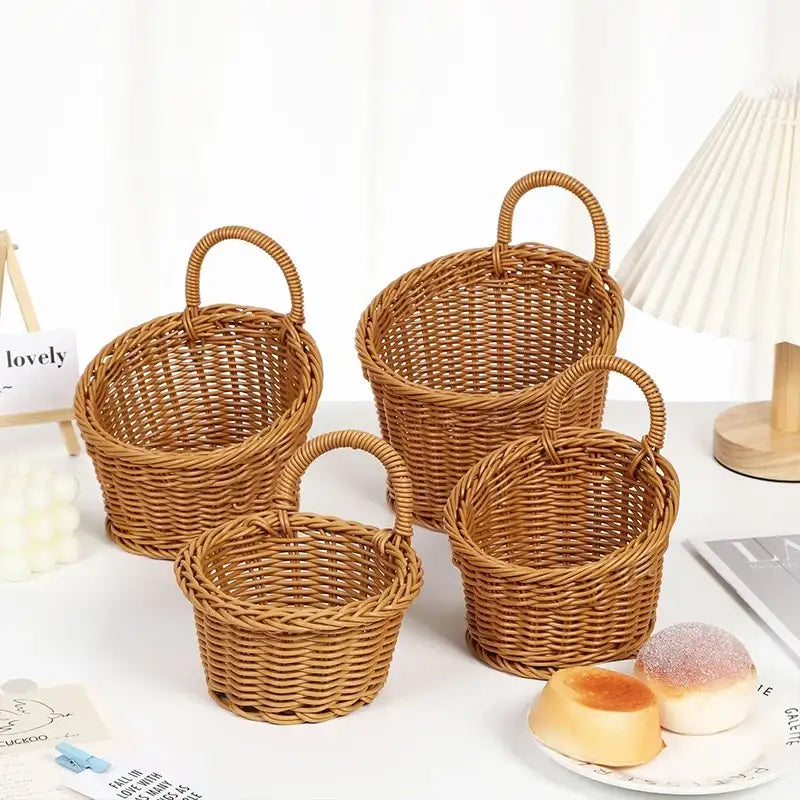 Set of wicker baskets with handles on a white surface