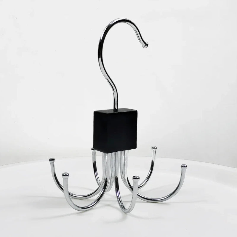 Metal hook with multiple arms on a white background