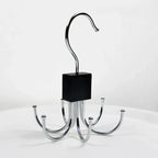Metal hook with multiple arms on a white background