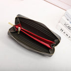 Black wallet with red interior on a white background