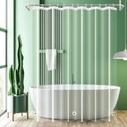 Bathroom with a freestanding bathtub, clear shower curtain, and green wall.