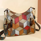 Multicolored patchwork handbag with geometric pattern on a beige background