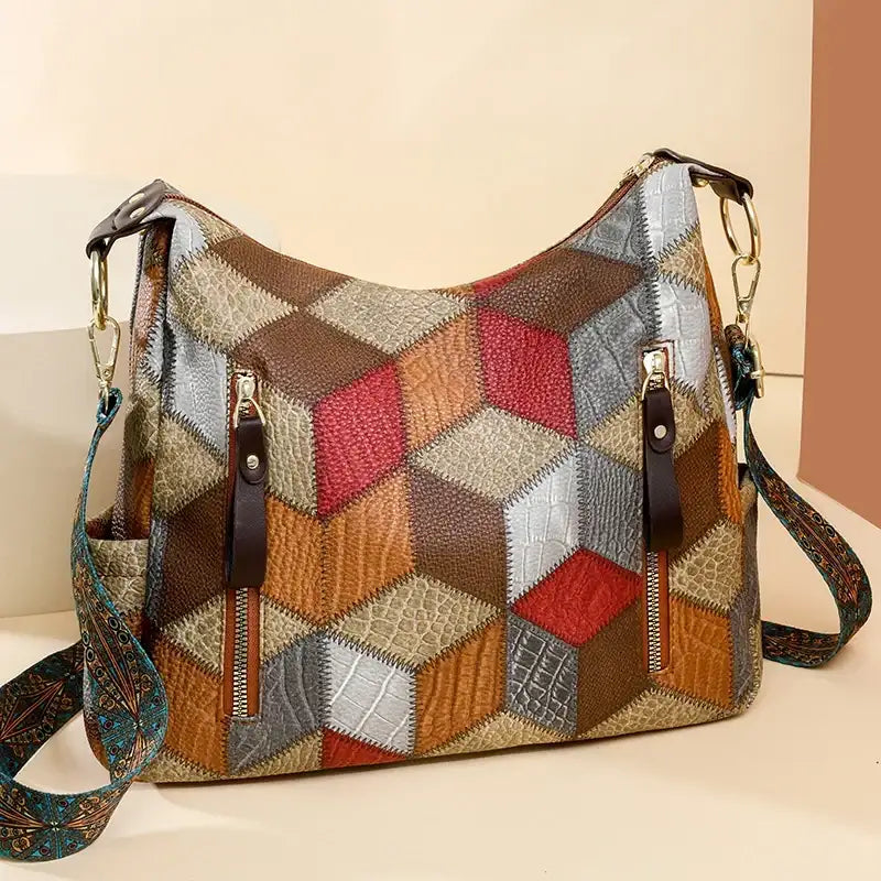 Multicolored patchwork handbag with geometric pattern on a beige background