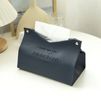 Navy blue tissue holder with 'Enjoy your life, sunshine' text on a white surface.