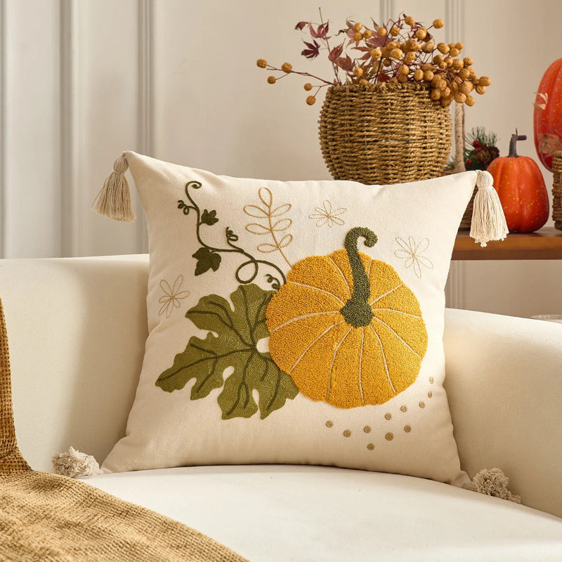 Decorative pillow with pumpkin design on a couch