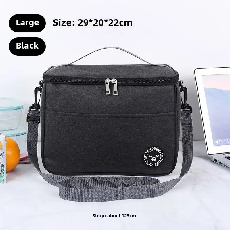 Black cooler bag with strap on a white surface, size and strap length information displayed.
