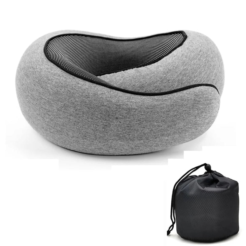 A gray contoured travel neck pillow with a black mesh interior, shown alongside its black drawstring storage pouch on a white background.