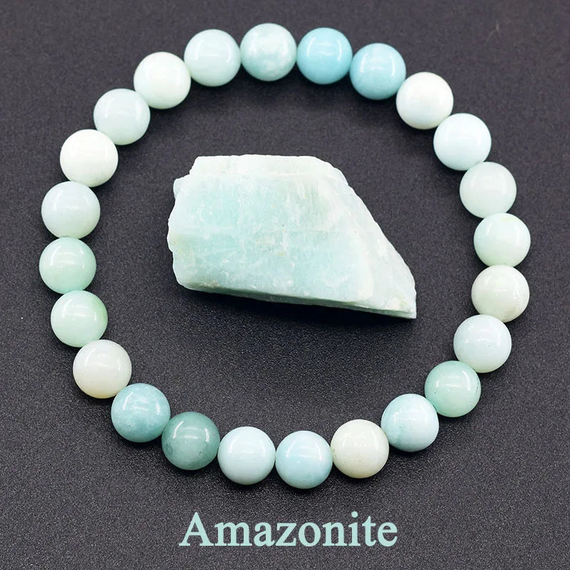 Amazonite bracelet with a piece of raw Amazonite stone on a dark background