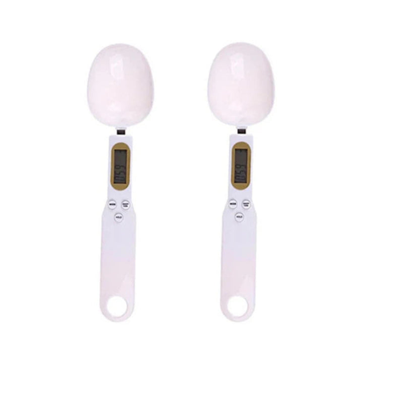 Two digital egg scales with white eggs on a white background